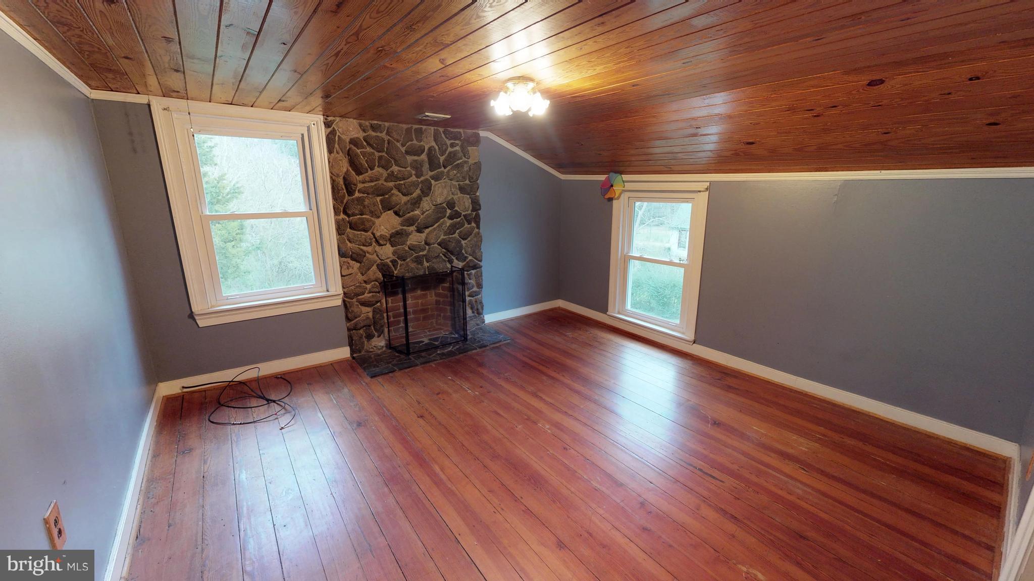 527 Hawkins Farm Road Bumpass, VA 23024 - Photo 28 of 30 wooden floor in an empty room with a window