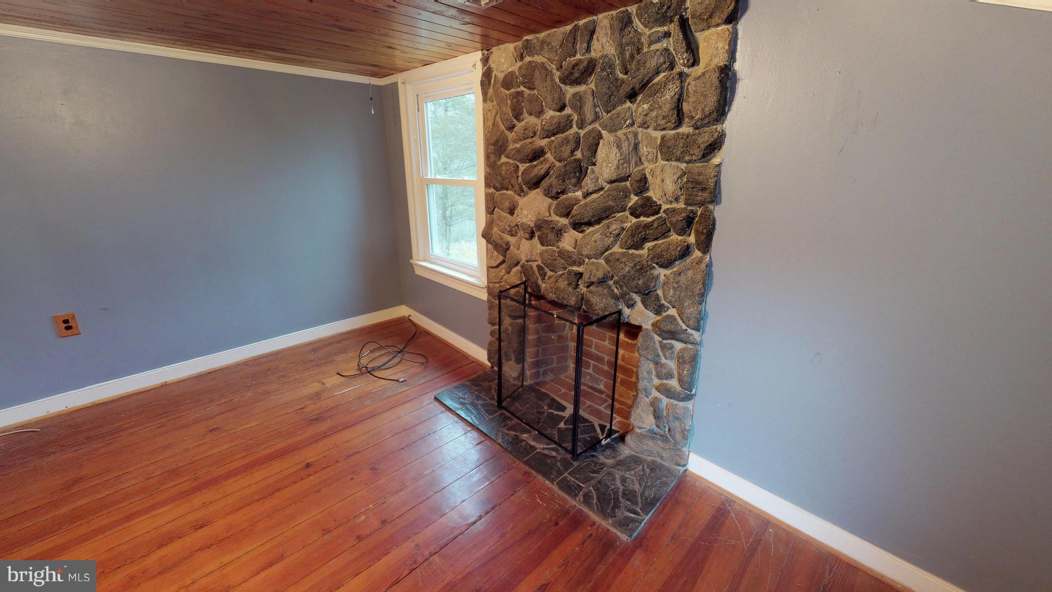 527 Hawkins Farm Road Bumpass, VA 23024 - Photo 29 of 30 a view of a room with wooden floor and a window