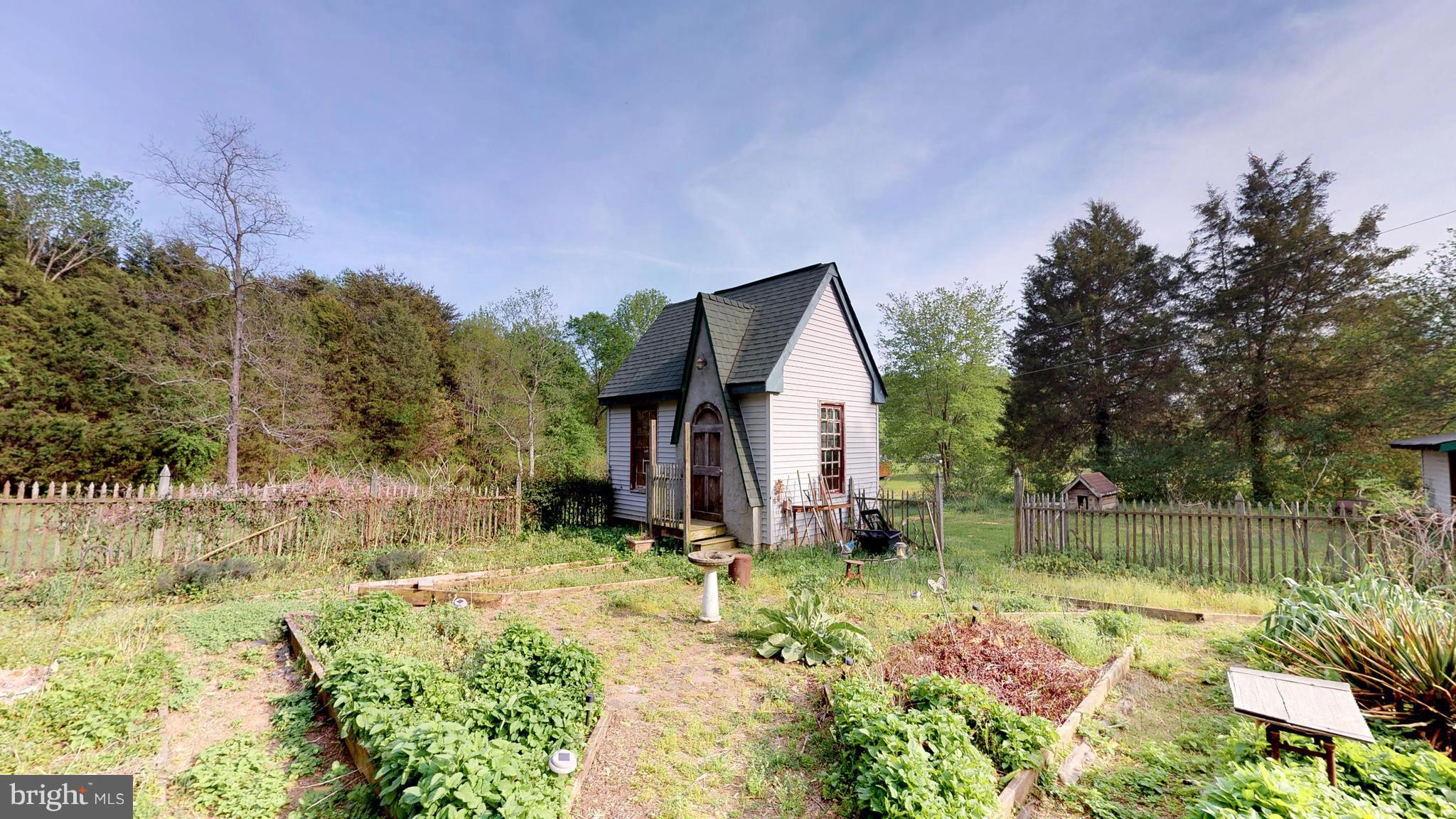 527 Hawkins Farm Road Bumpass, VA 23024 - Photo 10 of 30 a view of a house with yard and sitting area