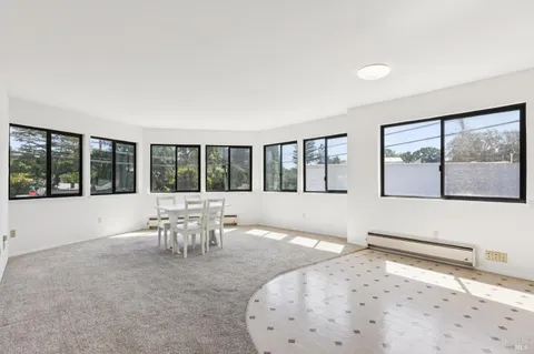 a view of a living room and dining room