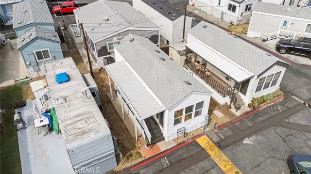 an aerial view of residential houses with outdoor space