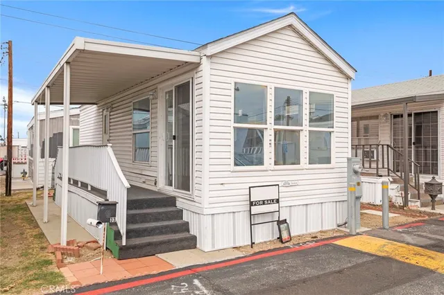 a view of a house with wooden fence