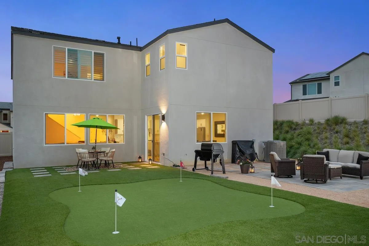 a view of a patio with table and chairs potted plants and a couch
