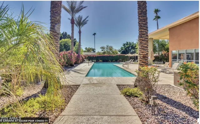 a view of swimming pool with outdoor seating
