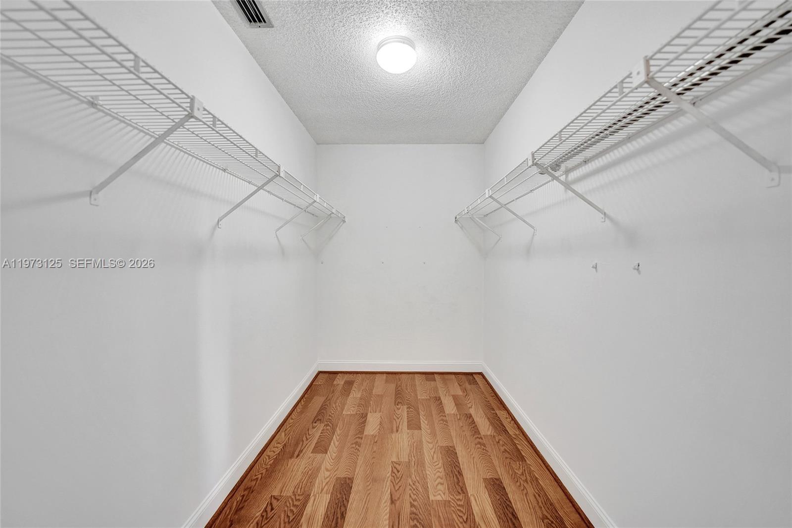 9340 Southwest 61st Way, Unit B Boca Raton, FL 33428 - Photo 11 of 25 a view of a room with racks on the wall