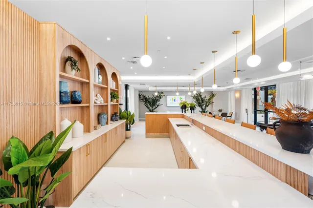 a view of a living room and kitchen