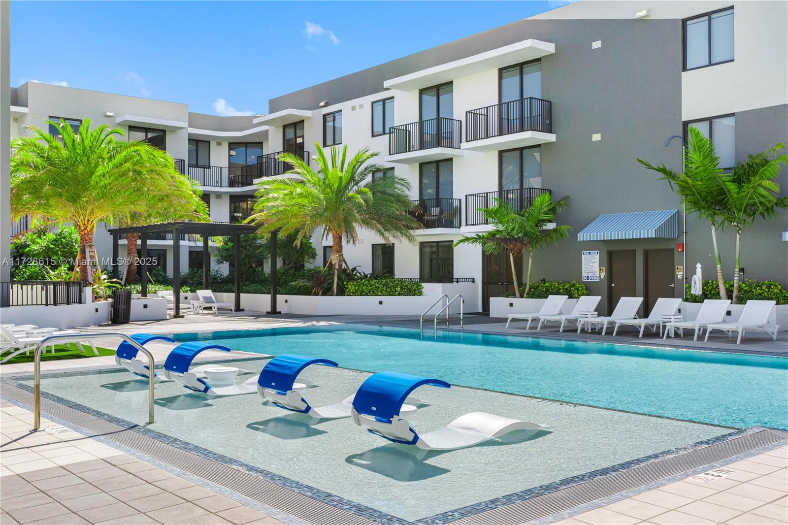 208 North Federal Highway, Unit 309 Pompano Beach, FL 33062 - Photo 19 of 29 a front view of house with yard and outdoor seating
