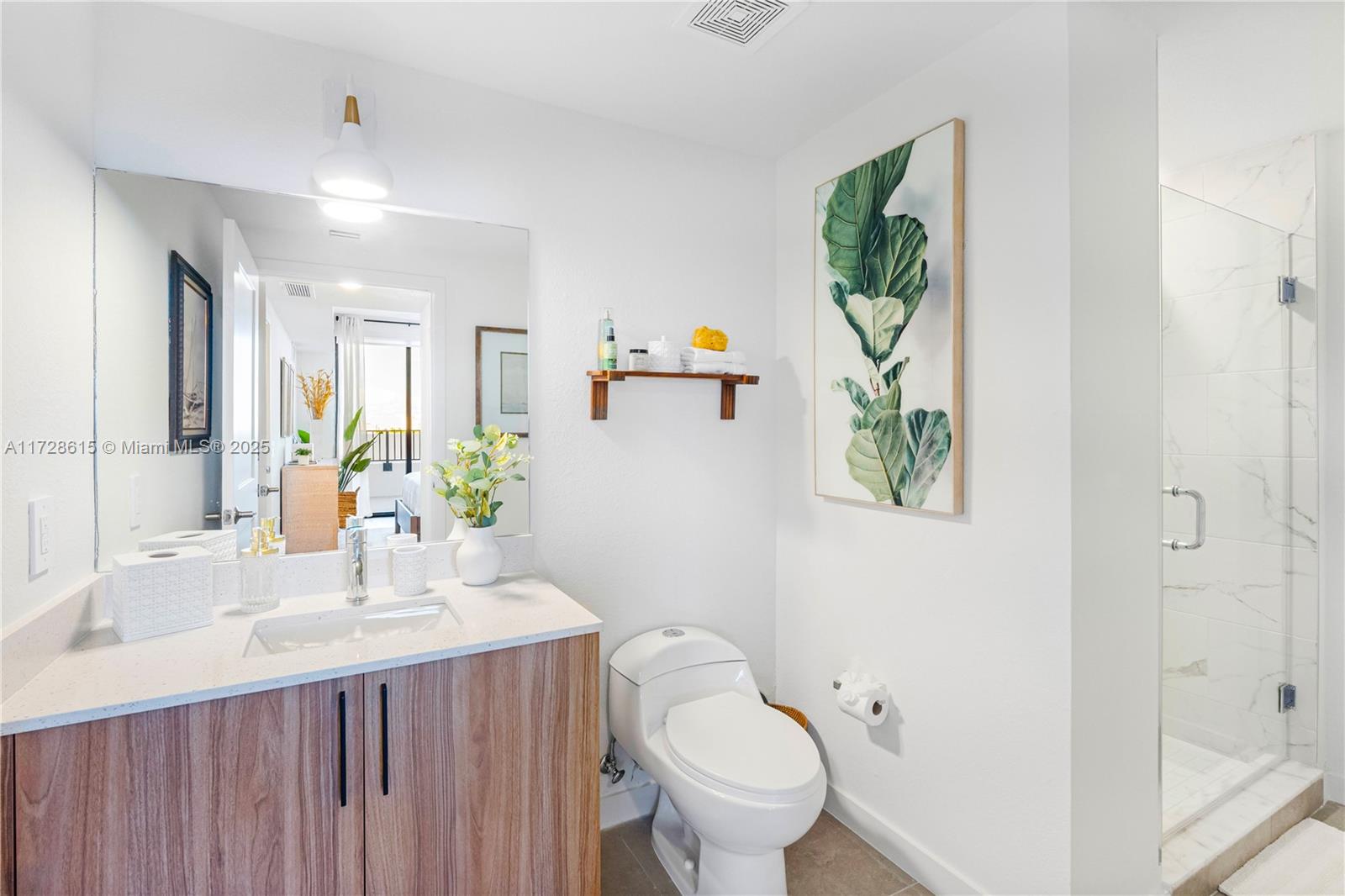 208 North Federal Highway, Unit 309 Pompano Beach, FL 33062 - Photo 7 of 29 a bathroom with a sink vanity mirror and toilet