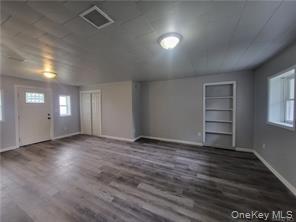 36 Houston Street Florida, NY 10921 - Photo 23 of 39 an empty room with wooden floor and windows