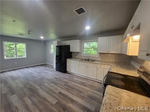 36 Houston Street Florida, NY 10921 - Photo 26 of 39 a kitchen with granite countertop a stove a sink and a refrigerator