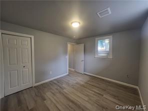 36 Houston Street Florida, NY 10921 - Photo 28 of 39 an empty room with wooden floor and windows