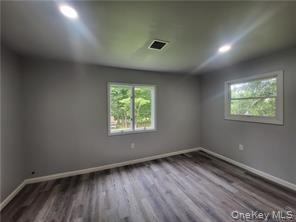 36 Houston Street Florida, NY 10921 - Photo 29 of 39 an empty room with wooden floor and windows