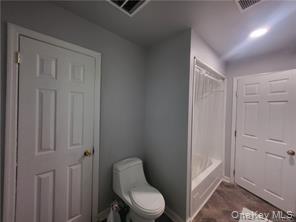 36 Houston Street Florida, NY 10921 - Photo 35 of 39 a white toilet sitting next to a bathroom sink