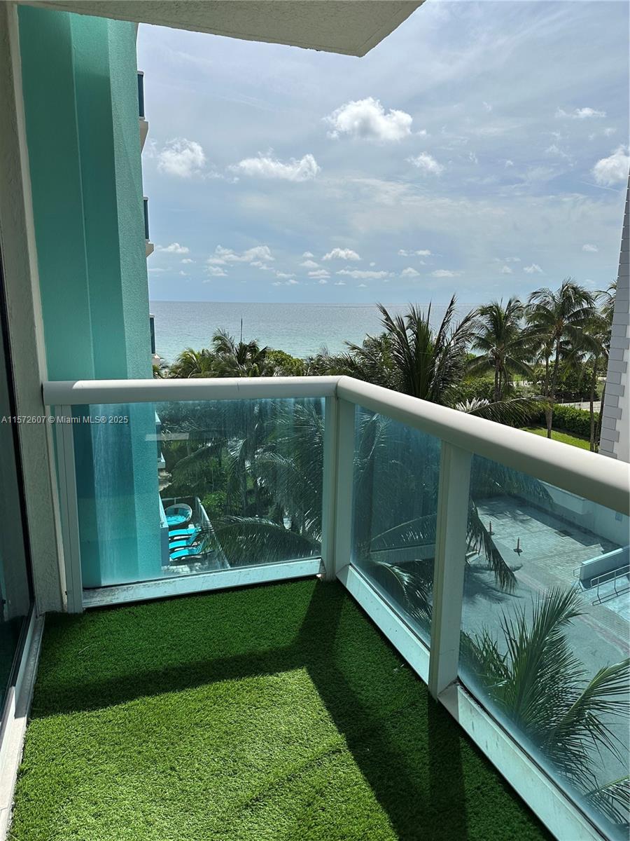 a view of swimming pool from a balcony
