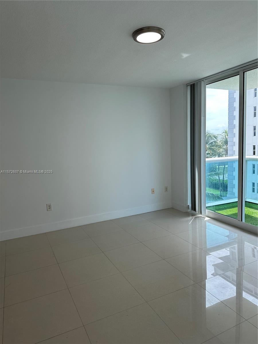 9201 Collins Avenue, Unit 524 Surfside, FL 33154 - Photo 11 of 20 an empty room with window