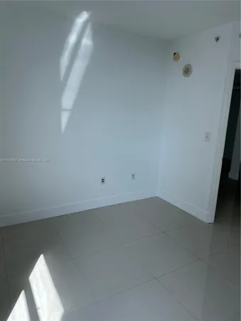 a view of an empty room with windows