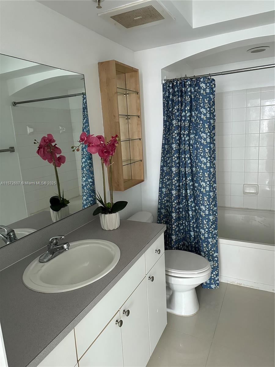9201 Collins Avenue, Unit 524 Surfside, FL 33154 - Photo 18 of 20 a bathroom with a sink toilet and shower