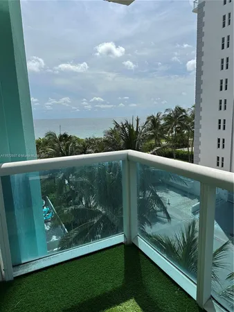 a view of a balcony with an outdoor space