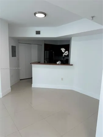 a view of an empty room with a bathroom