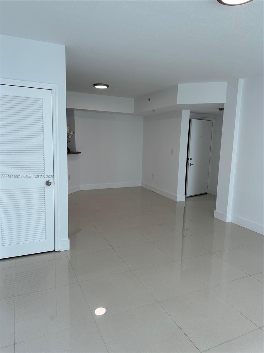 9201 Collins Avenue, Unit 524 Surfside, FL 33154 - Photo 10 of 20 a view of an empty room with a bathroom