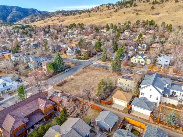 an aerial view of a residential houses with outdoor space
