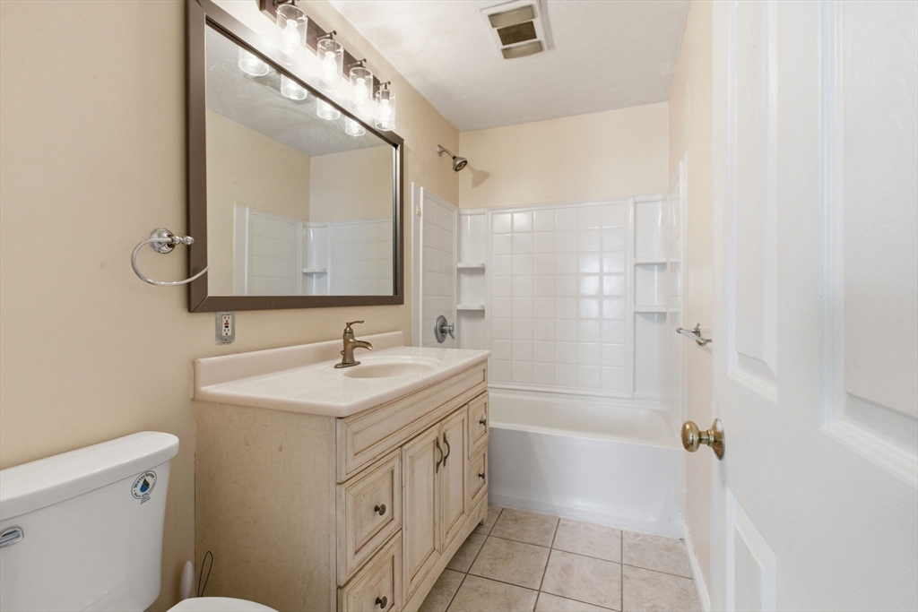 143 Commonwealth Avenue Worcester, MA 01604 - Photo 13 of 35 a bathroom with a sink a toilet and shower