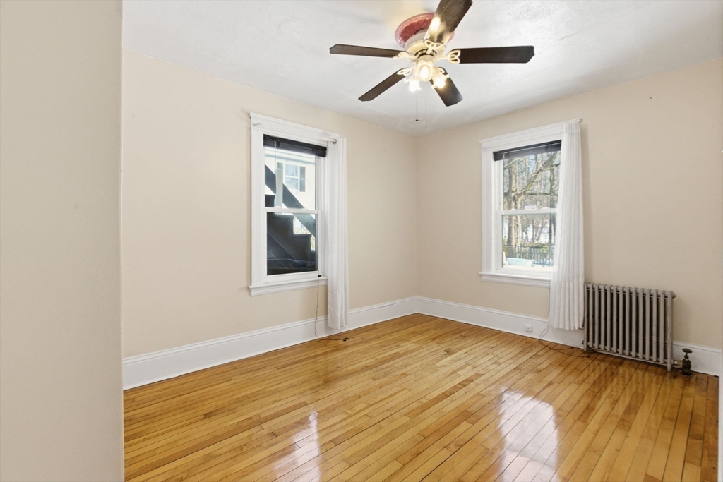 143 Commonwealth Avenue Worcester, MA 01604 - Photo 16 of 35 a view of an empty room with wooden floor and a window