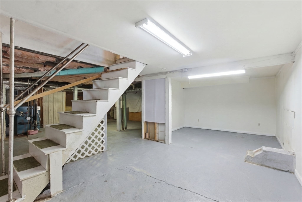 143 Commonwealth Avenue Worcester, MA 01604 - Photo 29 of 35 a view of an empty room with stairs