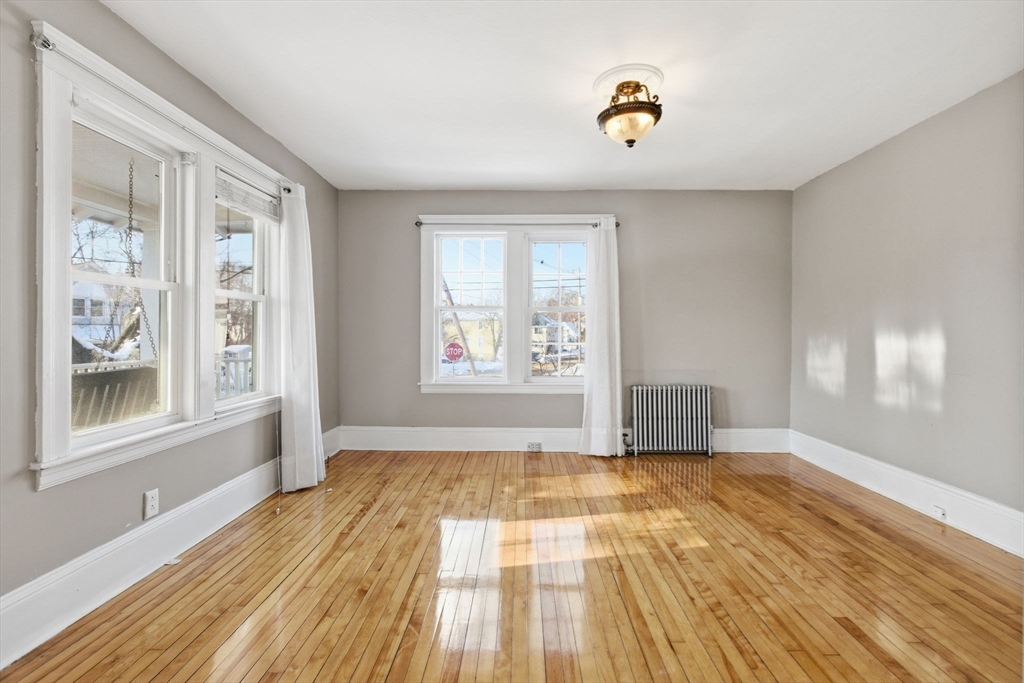 143 Commonwealth Avenue Worcester, MA 01604 - Photo 9 of 35 wooden floor in an empty room with a window