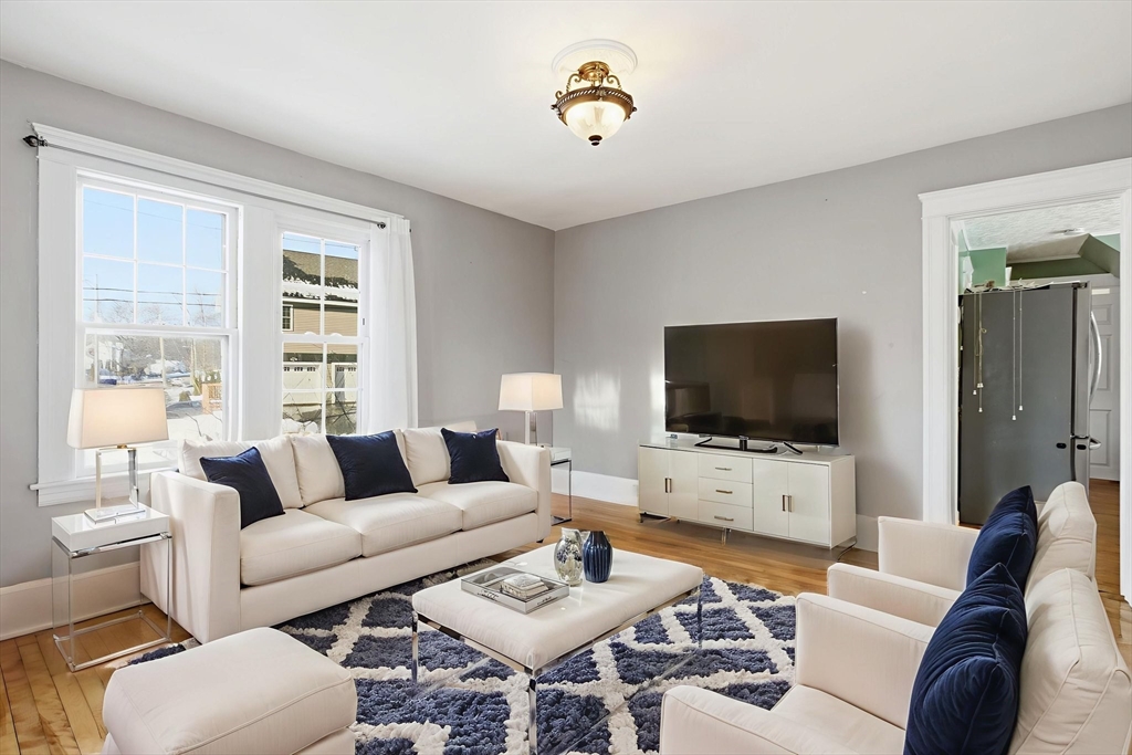 143 Commonwealth Avenue Worcester, MA 01604 - Photo 10 of 35 a living room with furniture and a flat screen tv