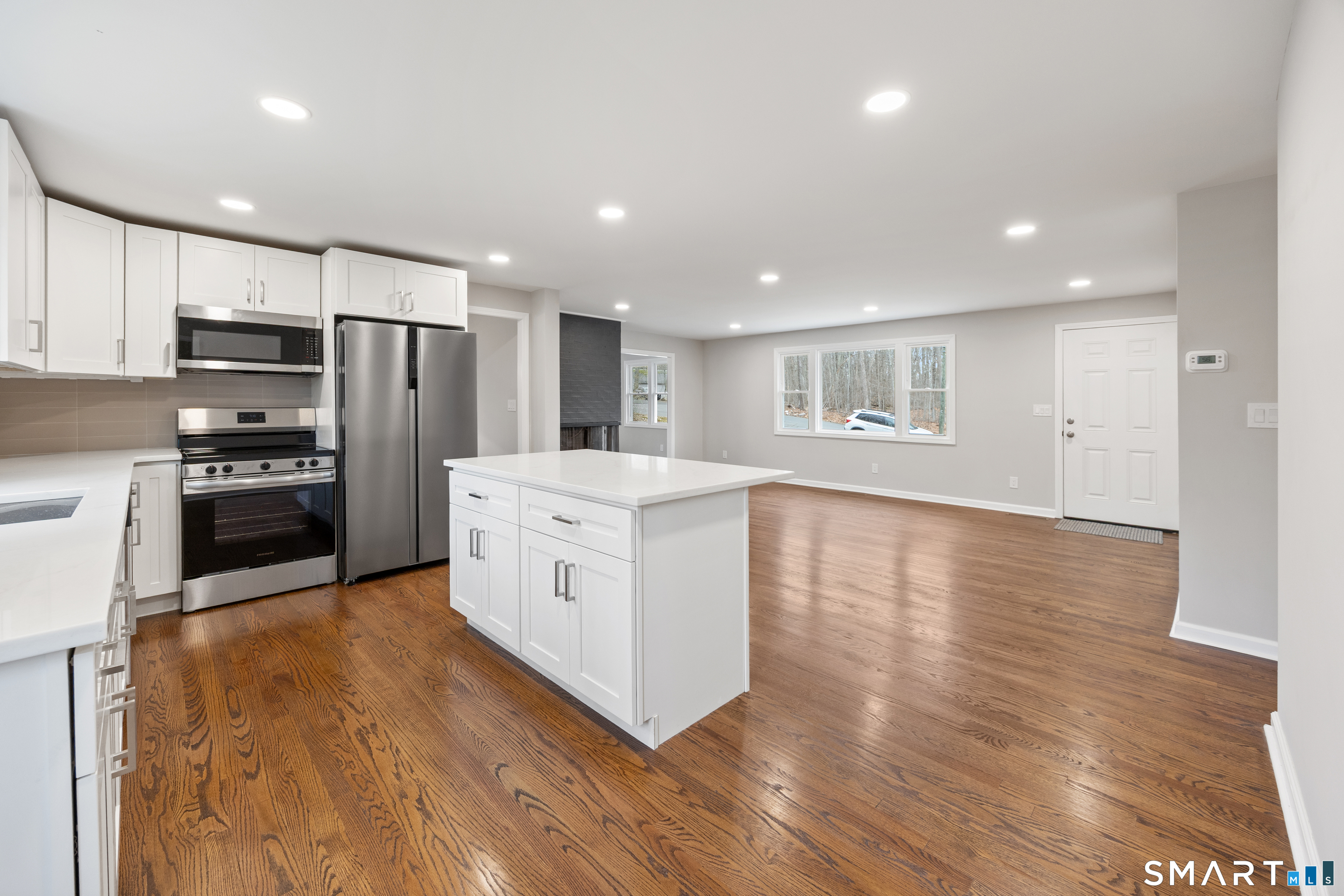 90 Troiano Road Hamden, CT 06518 - Photo 6 of 30 Kitchen and living room view.