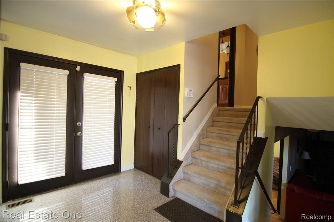 46500 Maidstone Road Canton, MI 48187 - Photo 7 of 29 Double doors open into the foyer