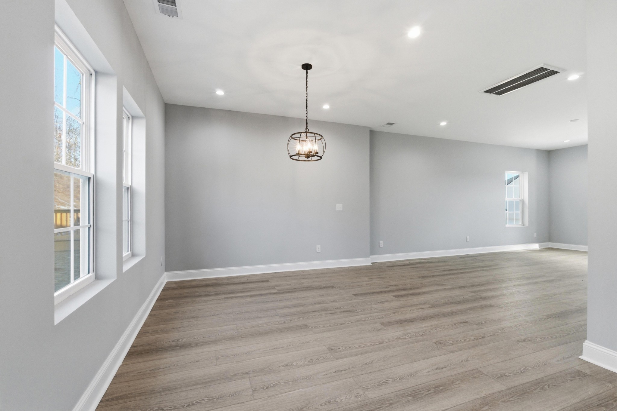 4741 Longbranch Antioch, TN 37013 - Photo 11 of 39 a view of an empty room with wooden floor and a window