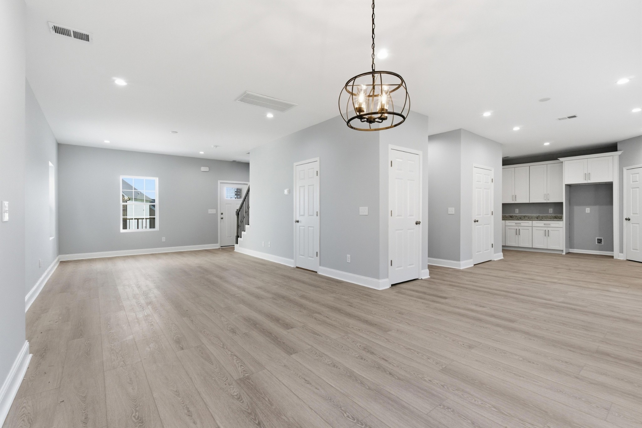 4741 Longbranch Antioch, TN 37013 - Photo 12 of 39 a view of an empty room with wooden floor and windows