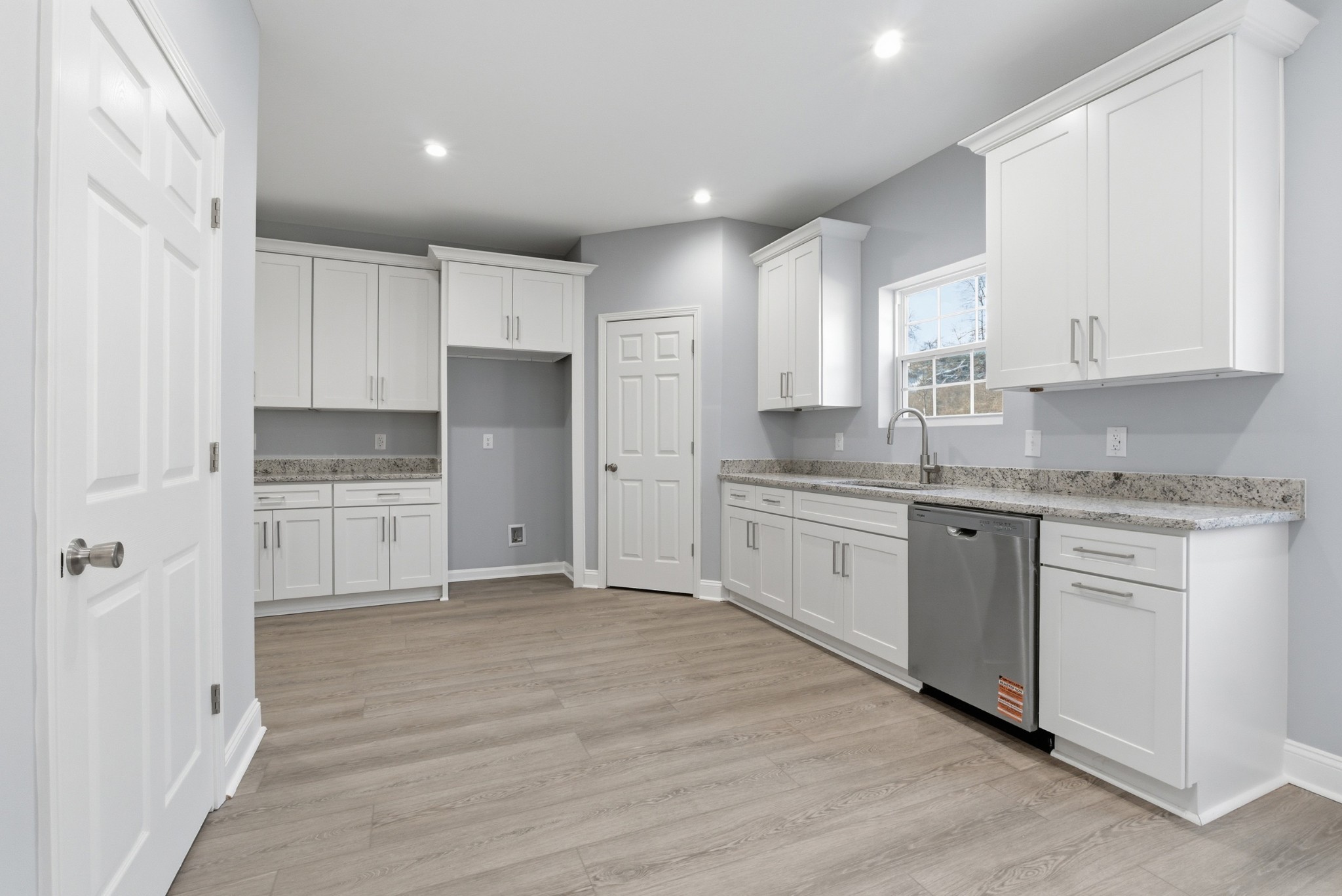 4741 Longbranch Antioch, TN 37013 - Photo 15 of 39 a kitchen with granite countertop white cabinets and white appliances