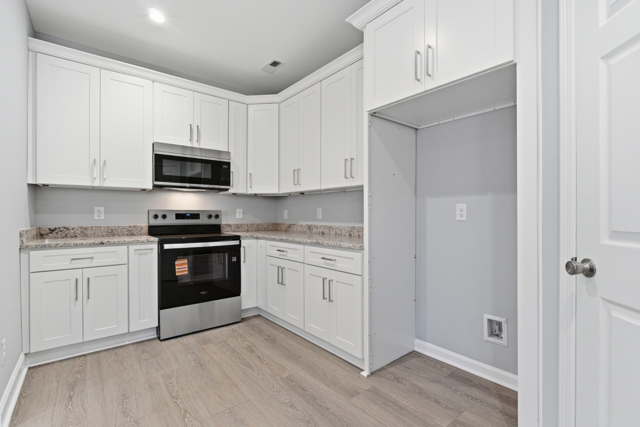 4741 Longbranch Antioch, TN 37013 - Photo 16 of 39 a kitchen with granite countertop white cabinets and stainless steel appliances