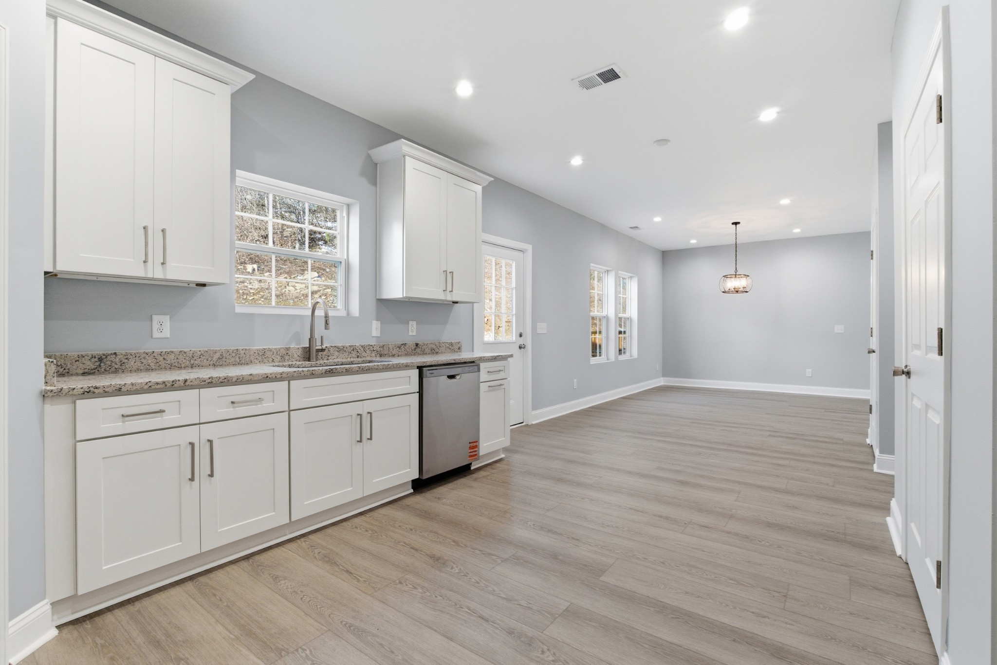 4741 Longbranch Antioch, TN 37013 - Photo 17 of 39 a large kitchen with granite countertop a large counter top and stainless steel appliances