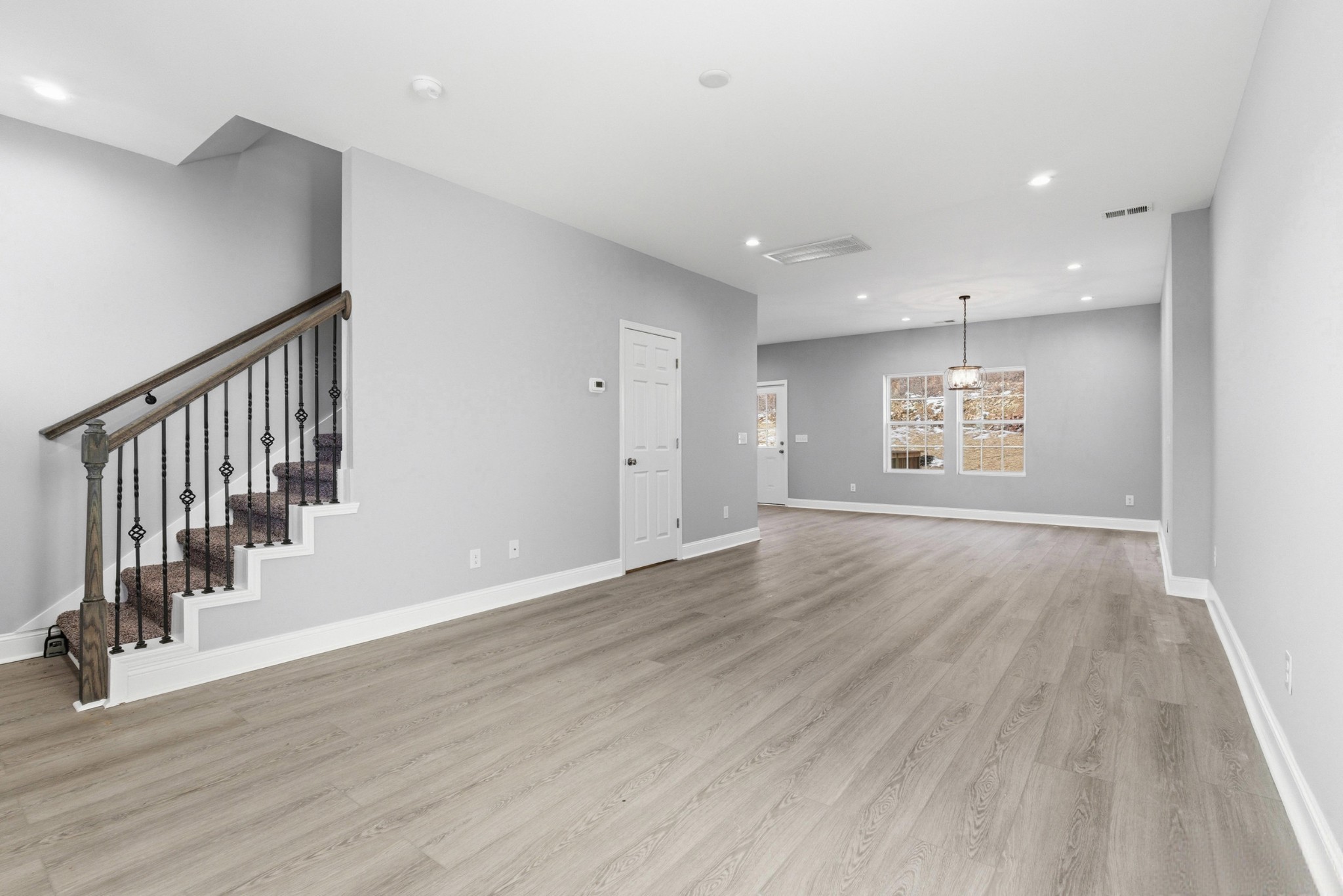4741 Longbranch Antioch, TN 37013 - Photo 5 of 39 an empty room with wooden floor and windows