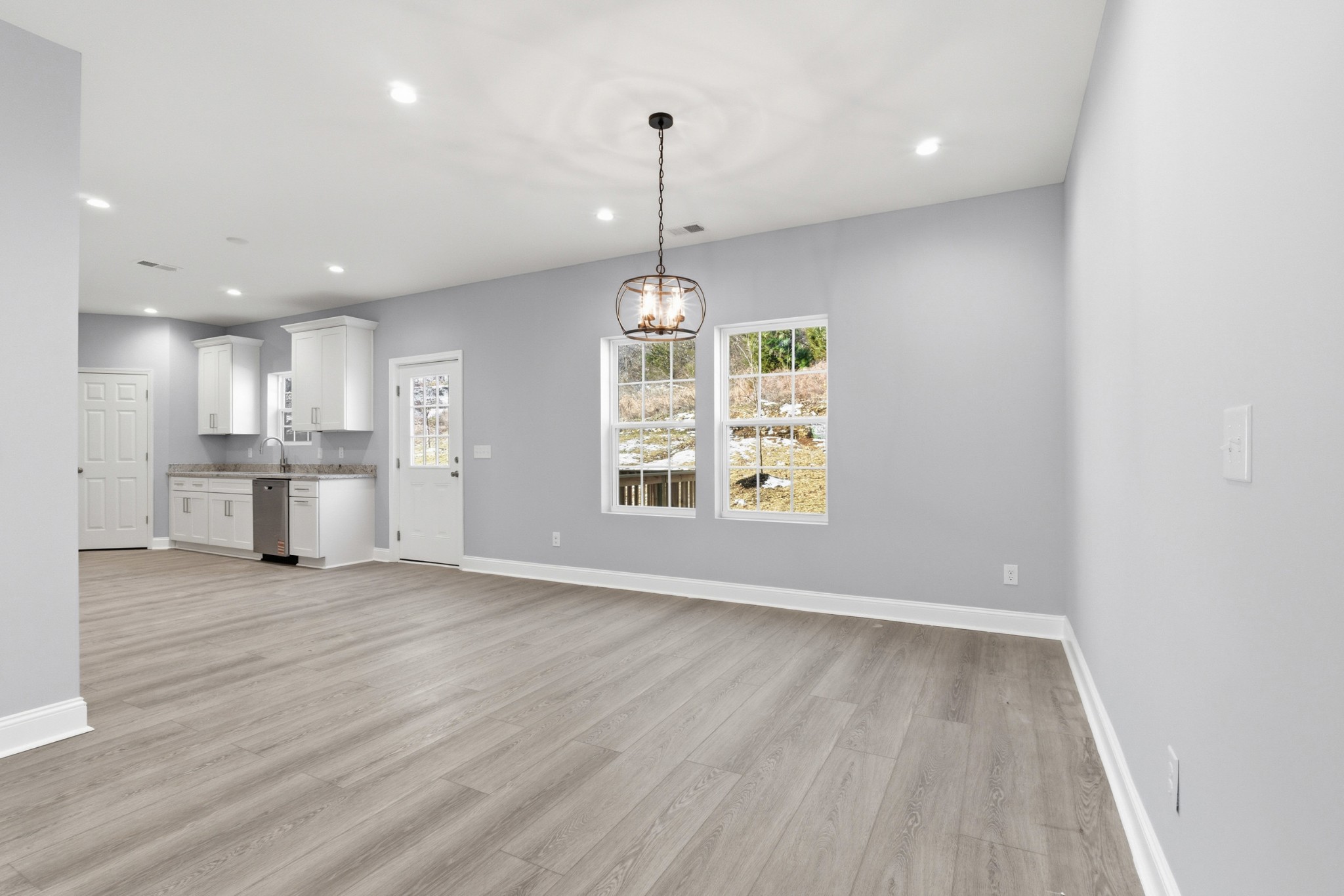4741 Longbranch Antioch, TN 37013 - Photo 9 of 39 an empty room with wooden floor wooden floors and windows