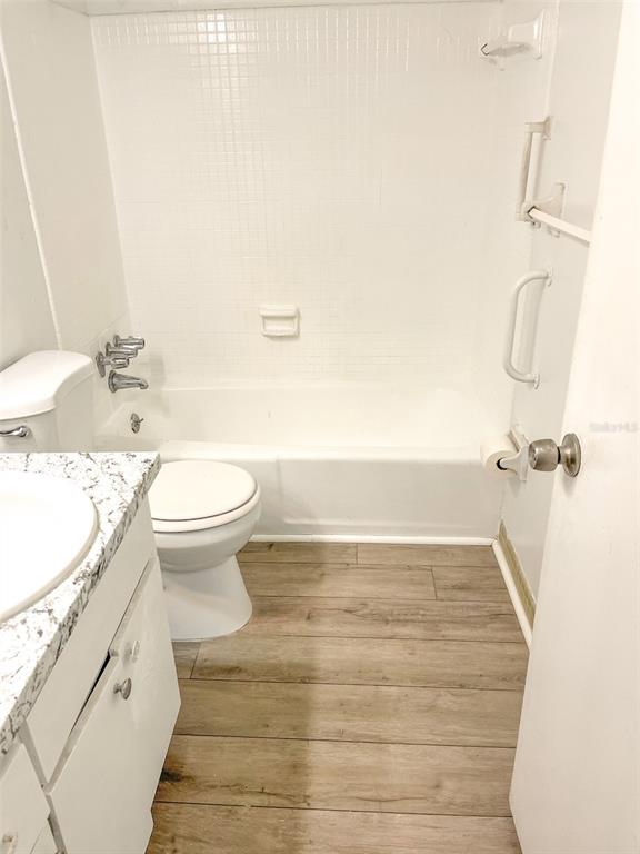 4335 Aegean Drive, Unit 108A Tampa, FL 33611 - Photo 5 of 16 a bathroom with a sink and a mirror