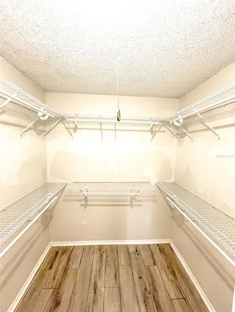 a view of a kitchen with furniture and natural light