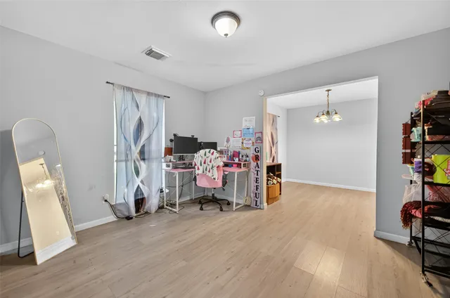 a view of a room with toys and wooden floor