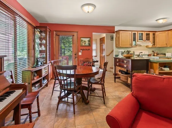 a view of a dining room with furniture window and outside view