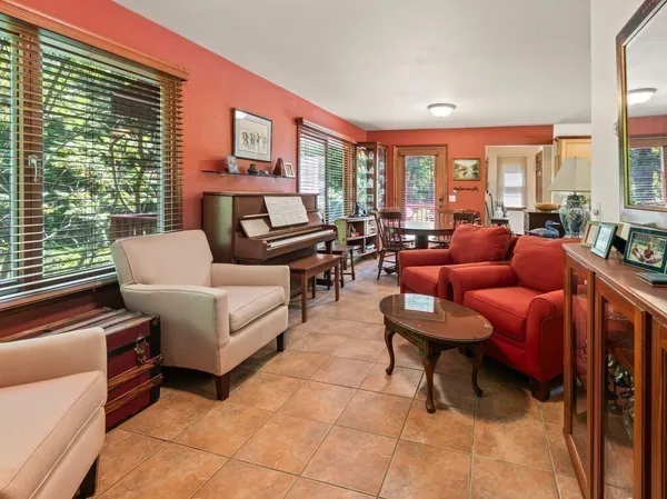 a living room with furniture and a large window