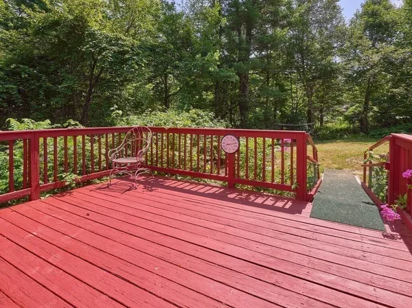a view of deck with wooden floor and outdoor seating
