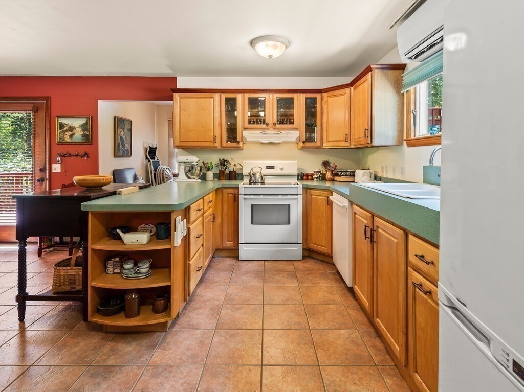189 Maple Avenue Rutland, MA 01543 - Photo 4 of 27 a kitchen with stainless steel appliances granite countertop a stove top oven a sink dishwasher and cabinets