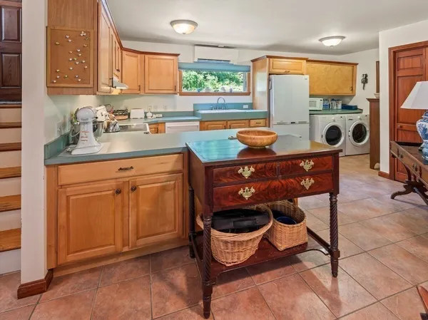a kitchen with a stove a sink and a microwave