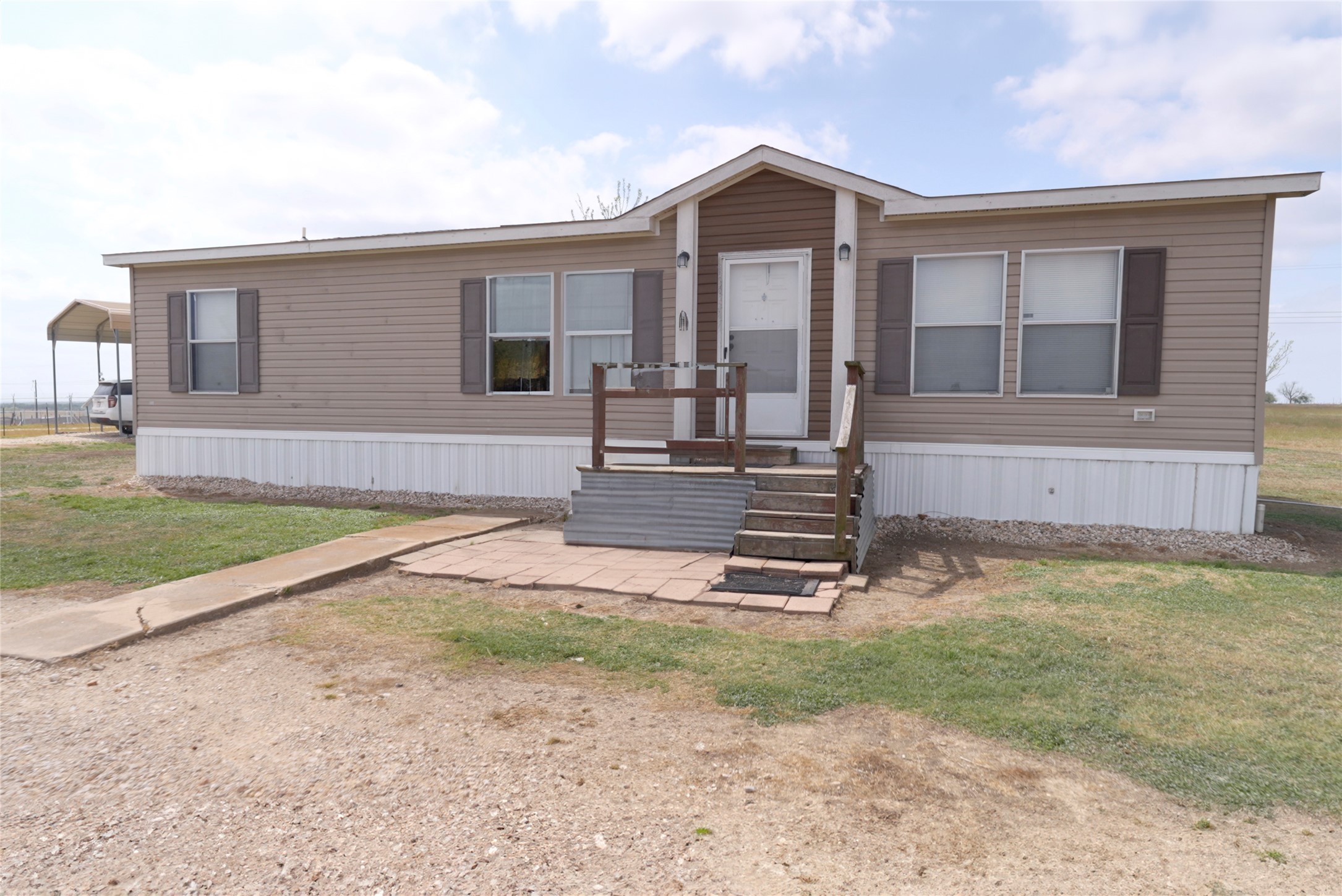 5101 County Road 463 Elgin, TX 78621 - Photo 19 of 38 a front view of a house with garden