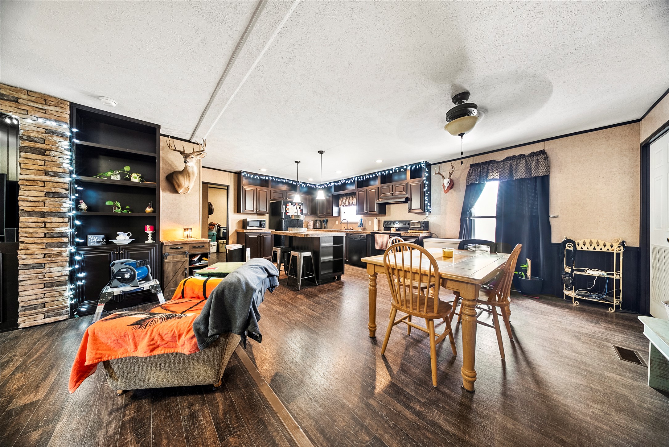 5101 County Road 463 Elgin, TX 78621 - Photo 20 of 38 a view of a dining room with furniture and wooden floor