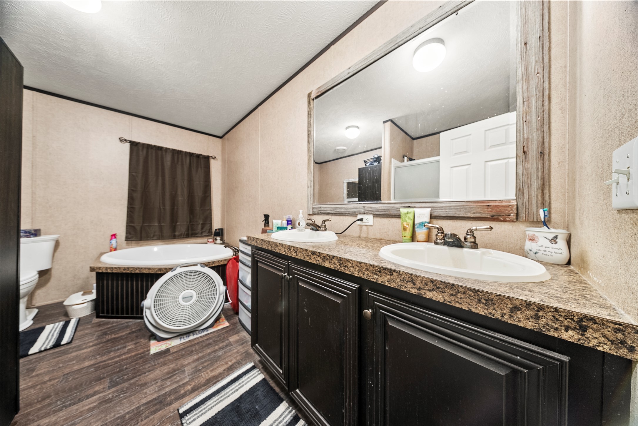 5101 County Road 463 Elgin, TX 78621 - Photo 27 of 38 a bathroom with a granite countertop double vanity and a sink